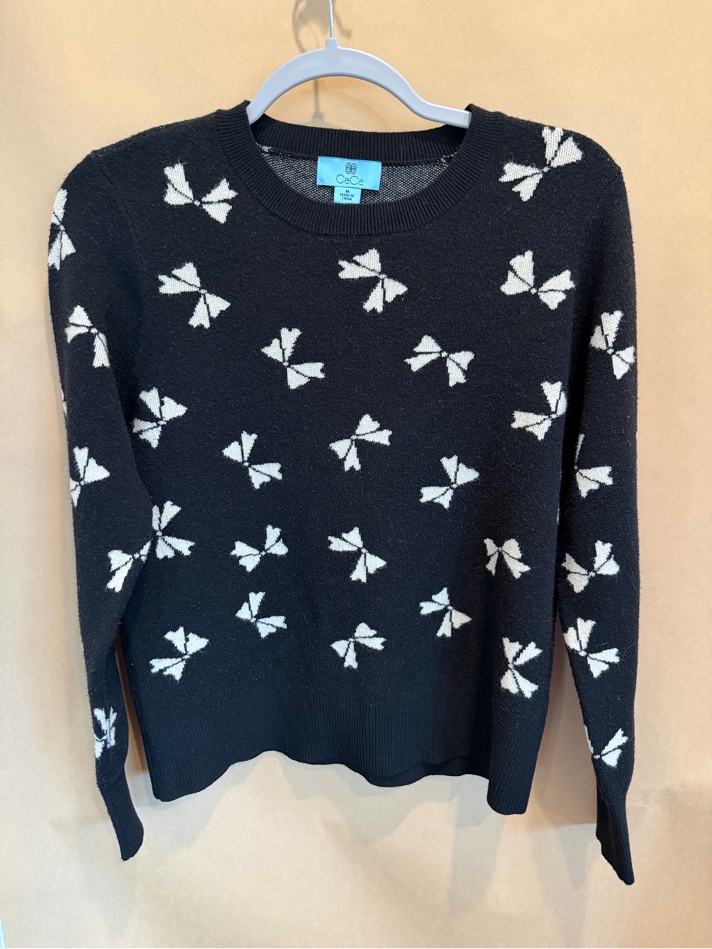 CeCe Black Crewneck Sweater with White Bow Motif